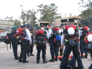 TX-TF2 members in a group with their gear on their back ready for a search